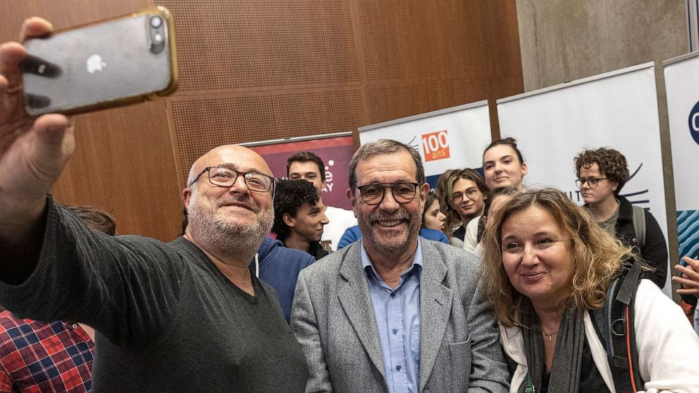 PHOTO: French physicist Alain Aspect takes photos with wellwishers at a press conference after winning the Nobel Prize, on Oct. 4, 2022 in Palaiseau, France. The Nobel Prize in Physics 2022 was awarded jointly to Aspect, John F Clauser and Anton Zeilinger